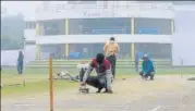  ?? HT PHOTO ?? ■
Groundsmen busy getting the pitch dry at the Kamla Club Ground in Kanpur on Saturday.