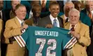  ?? Photograph: Jacquelyn Martin/AP ?? Members of the ‘72 Dolphins meet Barack Obama at a White House ceremony in 2013.