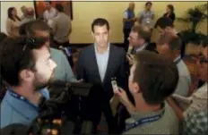  ?? GREGORY BULL — THE ASSOCIATED PRESS ?? Mets general manager Brodie Van Wagenen, center, speaks to reporters during the general managers meetings on Wednesday in Carlsbad, Calif.