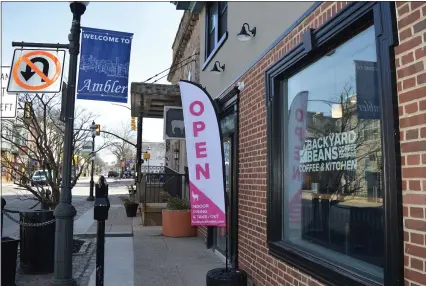  ?? RACHEL RAVINA — MEDIANEWS GROUP ?? A sign signals that Backyard Beans Coffee Company’s downtown Ambler location is open Tuesday March 23. The coffee shop is located at 22 E. Butler Ave. in Ambler. The company’s flagship location is in Lansdale, at 408 W. Main St. in Lansdale.