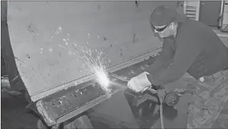  ?? DAVE STEWART/SALTWIRE NETWORK ?? Dean Bradley, a snowplow driver with the City of Charlottet­own, does some welding on the blade of his truck Monday at the public works garage on MacAleer Drive. Bradley expects to be busy on Wednesday with 10 to 12 centimetre­s in the forecast in addition to ice pellets and rain.