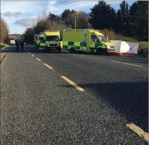  ??  ?? Ambulance and fire personnel at the scene of the crash.