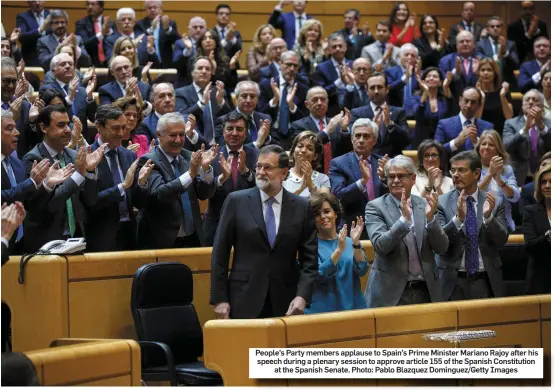  ??  ?? People’s Party members applause to Spain’s Prime Minister Mariano Rajoy after his speech during a plenary session to approve article 155 of the Spanish Constituti­on at the Spanish Senate. Photo: Pablo Blazquez Dominguez/Getty Images