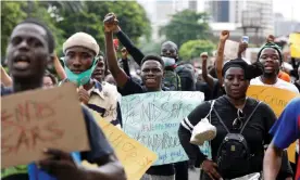  ??  ?? People protest against the Sars police unit in Lagos on Sunday. Photograph: Temilade Adelaja/Reuters