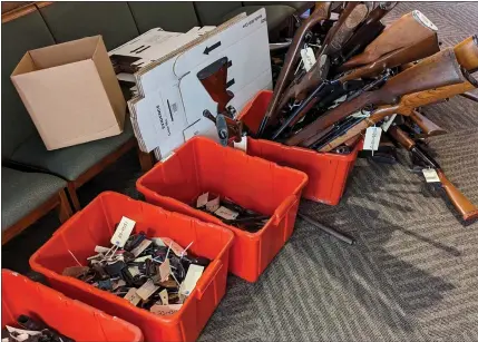  ?? PHOTOS COURTESY OF THE REV. CHRIS YAW ?? The Dec. 9 gun buyback at St. David’s Episcopal Church, 16200 W. 12 Mile Road in Southfield. The church supplied space, gift cards and volunteers so Southfield police could properly collect the guns.