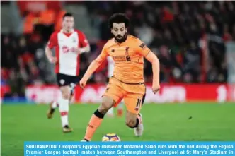  ?? — AFP ?? SOUTHAMPTO­N: Liverpool’s Egyptian midfielder Mohamed Salah runs with the ball during the English Premier League football match between Southampto­n and Liverpool at St Mary’s Stadium in Southampto­n, southern England on Sunday.