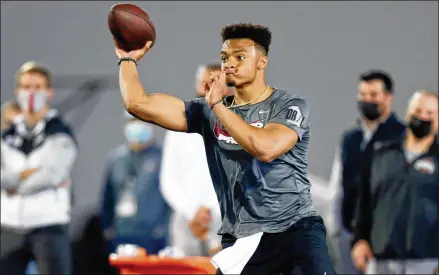  ?? PAUL VERNON/AP ?? Against Clemson in a CFP semifinal, Justin Fields completed 22 of 28 passes for 385 yards and six touchdowns. His passing yards were an Ohio State postseason record and the touchdowns tied him with Iowa’s Chuck Long for a postseason record by a Big Ten QB.