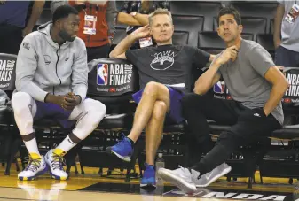  ?? Paul Chinn / The Chronicle 2019 ?? If the new NBA season starts when scheduled, Draymond Green (left), head coach Steve Kerr (center) and general manager Bob Myers will be leading a team coming off a ninemonth break.