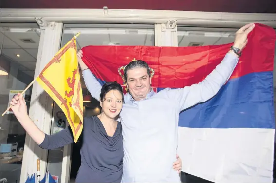  ??  ?? Flag bearers
Karen and Nino show off their colours at Cafe le Monde ahead of next week’s huge Scotland v Serbia clash