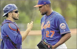  ?? DAVID J. PHILLIP / ASSOCIATED PRESS ?? Mets catcher Travis d’Arnaud, talking with relief pitcher Jeurys Familia at spring training in Port St. Lucie, aims to get back on track this season.