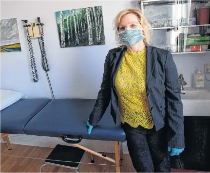  ?? TIM KROCHAK • THE CHRONICLE HERALD ?? Physician Maria Patriquin is seen in a treatment room at the Living Well Clinic in Halifax on April 29.