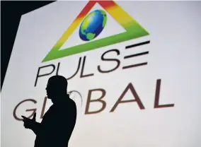  ??  ?? The Pulse Global logo forms the backdrop to Executive Chairman Kingsley Cooper’s silhouette, at the launch of the Pulse Global held at the Palace Cineplex cinema, at Sovereighn Centre in Liguanea, Kington on Tuesday, April 9, 2018.