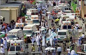  ?? AP/Saudi Press Agency ?? Ambulances line the street in Mecca on Thursday after people were crushed by the crowd in Mina, Saudi Arabia, during the annual hajj.