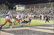  ?? Tim Godbee ?? Calhoun sophomore Emaree Winston bulls his way into the end zone for the Yellow Jackets’ first touchdown Friday night against Kell. Winston was injured on the play.