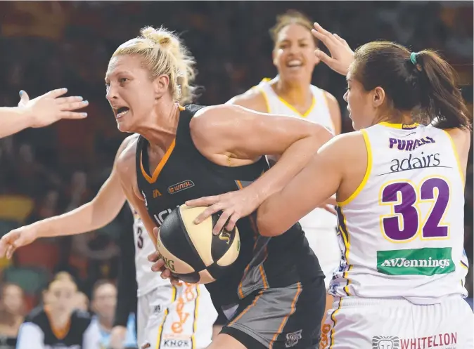  ?? FINDING A WAY: Townsville Fire superstar Suzy Batkovic is guarded by Maddie Garrick and Kalani Purcell of the Melbourne Boomers. Picture: ZAK SIMMONDS ??