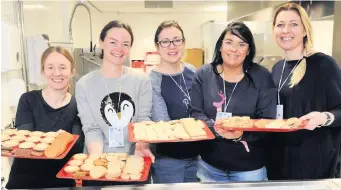  ?? 291118burn­side_02 ?? Teatime treats Burnside Primary canteen staff serve up cookies and cakes at the tea stall