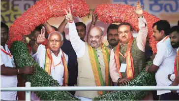  ??  ?? BJP President Amit Shah with Union Minister Ananth Kumar and Karnataka unit President B S Yeduyurapp­a during the launch of party’s 75-day ‘Nava Karnataka Nirmana Parivartan Yatra’ in Bengaluru