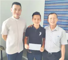  ??  ?? Father Francis (left) with Sau Jee and his father after getting the results.