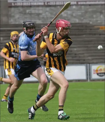  ??  ?? Conor Hearne of Shelmalier­s about to strike as Cian McGovern (St. Anne’s) gives chase.