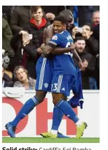  ??  ?? Solid strike: Cardiff’s Sol Bamba (left) celebratin­g with Kadeem Harris after scoring against Brighton during the English Premier League match at the Cardiff City Stadium yesterday. — AP