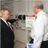  ?? FEMA/EARL ARMSTRONG PHOTO ?? Bert Gumeringer, left, director of facilities and security at Texas Children’s Hospital, shows FEMA Deputy Administra­tor Rich Serino the operations of a “submarine door”—one of many designed to halt flooding in the tunnel system under the Texas Medical...