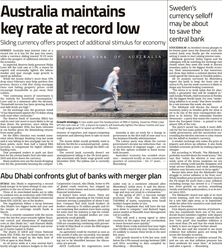  ??  ?? Growth strategy: A man walks past the headquarte­rs of RBA in Sydney. Governor Philip Lowe left the cash rate at 1.5%, a stance he expects will eventually tighten the labour market and spur enough wage growth to speed up inflation. — Reuters