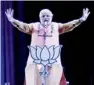  ?? — AP ?? Narendra Modi addresses the public via a 3D projection.