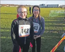  ??  ?? Abbie Stewart and Beth McCarthy are all smiles on the track.