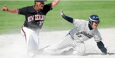  ?? GETTY IMAGES ?? Nathan Nukunuku, pictured playing against Japan, will lead New Zealand in his 20th season of internatio­nal softball.