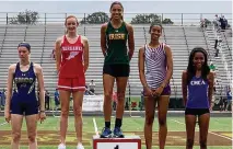  ?? CONTRIBUTE­D BY CATHOLIC CENTRAL HIGH SCHOOL ?? Catholic Central’s Mallory Mullen stands atop the podium after winning the Division III state championsh­ip in the high jump on Friday, June 4, 2021.