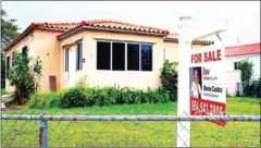  ?? JOE RAEDLE/GETTY IMAGES/AFP ?? A For Sale sign is seen outside of a home on January 30, 2019 in Miami, Florida.