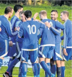  ??  ?? Congrats Bathgate’s players mob Robbie Feeney after his strike