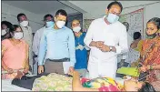  ?? AFP ?? Andhra Pradesh health minister Alla Nani visits patients at a government hospital in Eluru on Wednesday.