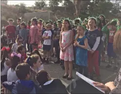  ?? Christina Cox/The Signal ?? Third grade students at Leona Cox Community School perform “Statue of Liberty” during the school’s Constituti­on Day Assembly on Friday.