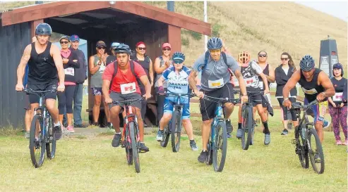  ?? Photo / Adam Pearse ?? Eager cyclists make a fast start below the Waikaretu Marae at the Pouto¯ Lighthouse Challenge on Saturday.