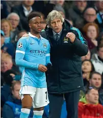  ??  ?? City manager Pellegrini (right) talks with substitute Sterling before he is brought on during the UEFA Champions League semifinal.