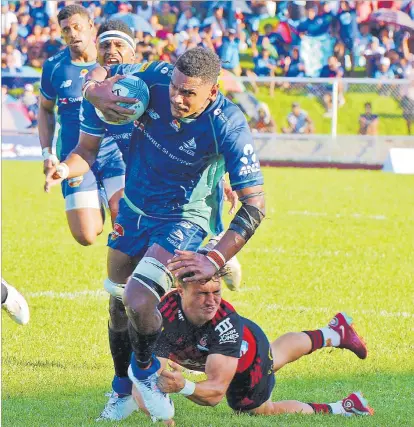  ?? Picture: BALJEET SINGH ?? Swire Shipping Fijian Drua flanker Kitione Salawa bursts through the Crusaders defence to set up Eroni Sau’s try during their Super Rugby clash at Churchill Park in Lautoka on Saturday.