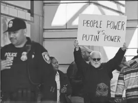  ?? AP photo ?? A protestor stands outside federal court in Washington as former Trump national security adviser Michael Flynn is inside.