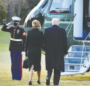  ?? MANDEL NGAN / AFP VIA GETTY IMAGES ?? Donald and Melania Trump prepare to board Marine One before departing the White House for the final time on Wednesday. The couple broke with tradition, skipping the Biden inaugurati­on to travel instead to their Florida home.