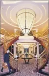  ?? STEVE MACNAULL PHOTO ?? The two-storey chandelier in the atrium of the Regent Explorer is the largest of over 300 chandelier­s on the ship.