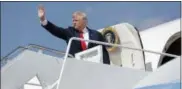  ?? EVAN VUCCI — THE ASSOCIATED PRESS ?? President Donald Trump waves as he boards Air Force One at Andrews Air Force Base, Md., Friday.