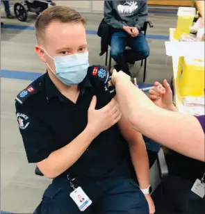  ?? Interior Health/Special to The Daily Courier ?? A paramedic stationed in the B.C. Interior receives his first dose of the COVID-19 vaccine. Roughly 700,000 people in this region are eligible for the shot.