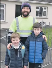  ??  ?? Primary school pupils, Liam and Jack O’Rourke, pictured with their dad Micheál, prior to Liam returning to school in Ballygibli­n N.S. earlier this week.
