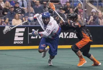  ?? RICK MADONIK TORONTO STAR FILE PHOTO ?? Toronto
Rock’s Adam Jones evades Buffalo Bandits’ Mark Steenhuis during NLL action in 2017. Cross-border travel is still an issue that needs to be worked out before the league can begin play.