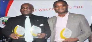  ??  ?? L-R: General Manager Marketing & Corporate Communicat­ions, Coscharis Group, Abiona Babarinde; and Brand Manager Ford, Coscharis Motors PLC, Felix Mahan, showing off various awards won by Coscharis brands at the year 2017 Nigeria Auto Journalist­s...