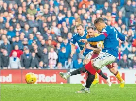  ?? Picture: SNS. ?? James Tavernier hits the post with his penalty kick.