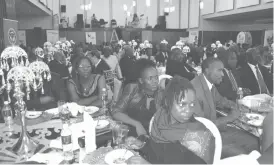  ?? (ZNCC) ?? People follow proceeding­s during the Zimbabwe National Chamber of Commerce Matabelela­nd region Business Awards ceremony at a Bulawayo hotel on Friday