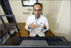  ?? LM OTERO — THE ASSOCIATED PRESS ?? Medical director of Doctor on Demand Dr. Vibin Roy speaks to a patient during an online primary care visit from his home, April 23in Keller, Texas.