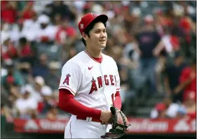  ?? MICHAEL OWEN BAKER - THE ASSOCIATED PRESS ?? Los Angeles Angels pitcher Shohei Ohtani smiles after finishing the seventh inning of a baseball game against the Seattle Mariners, Sunday, Sept. 26, 2021, in Anaheim, Calif. The Mariners won 5-1.