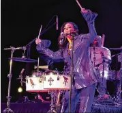  ?? AKILI-CASUNDRIA RAMSESS FOR THE AJC ?? Even at 64 years old, Sheila E. rocks the stage at the Stockbridg­e Amphitheat­er on Saturday with her ageless drumming skills and a big selection of hits, including several by mentor Prince.